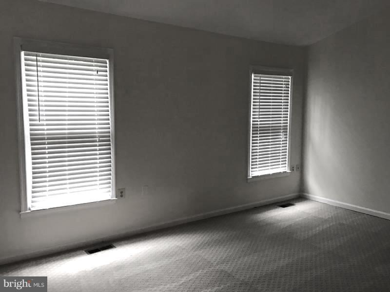 10504 Grove Ridge Place, Unit 48 Rockville, MD 20852 - Photo 20 of 30 a view of an empty room with a window