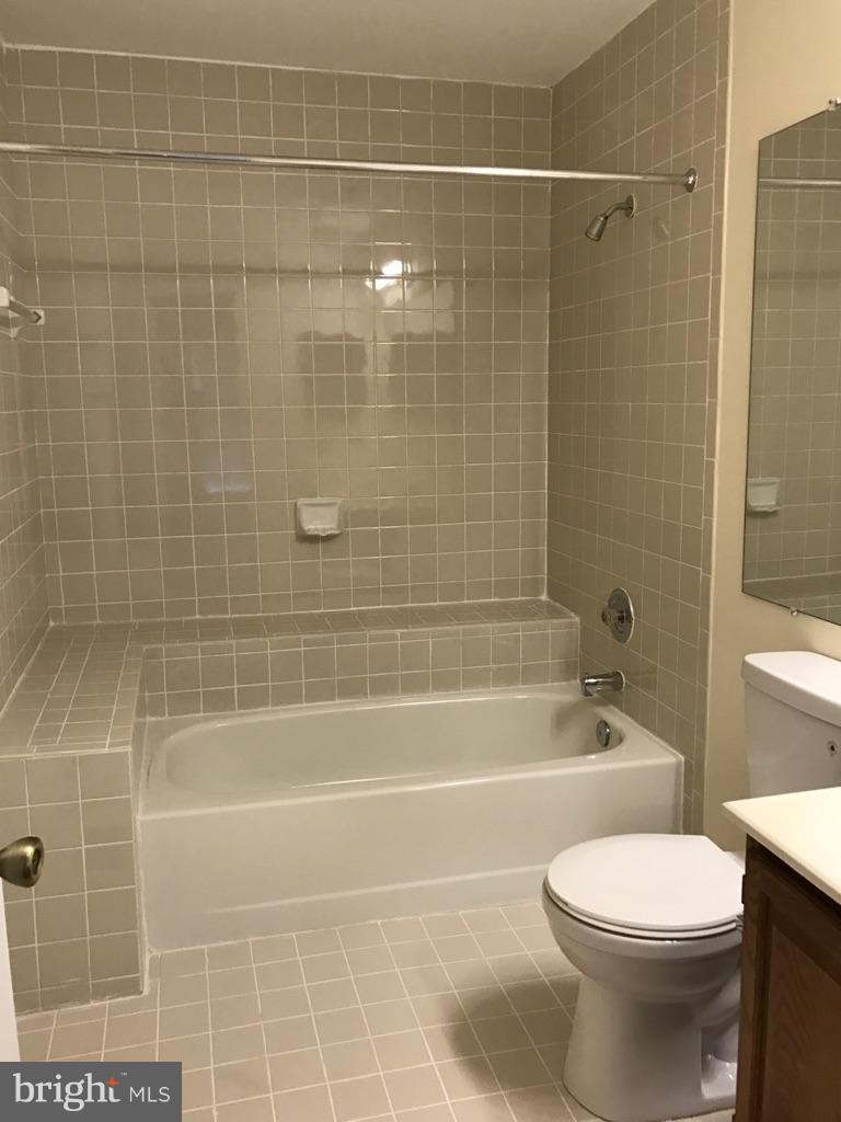 10504 Grove Ridge Place, Unit 48 Rockville, MD 20852 - Photo 22 of 30 a bathroom with a toilet and shower