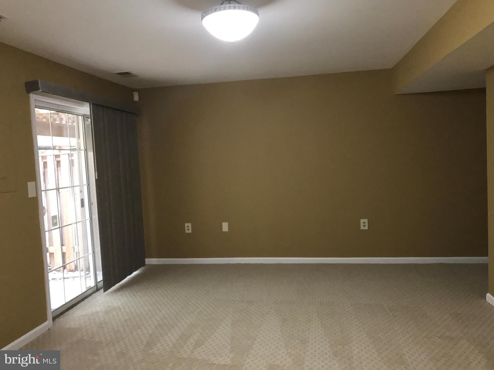 10504 Grove Ridge Place, Unit 48 Rockville, MD 20852 - Photo 25 of 30 an empty room with a window