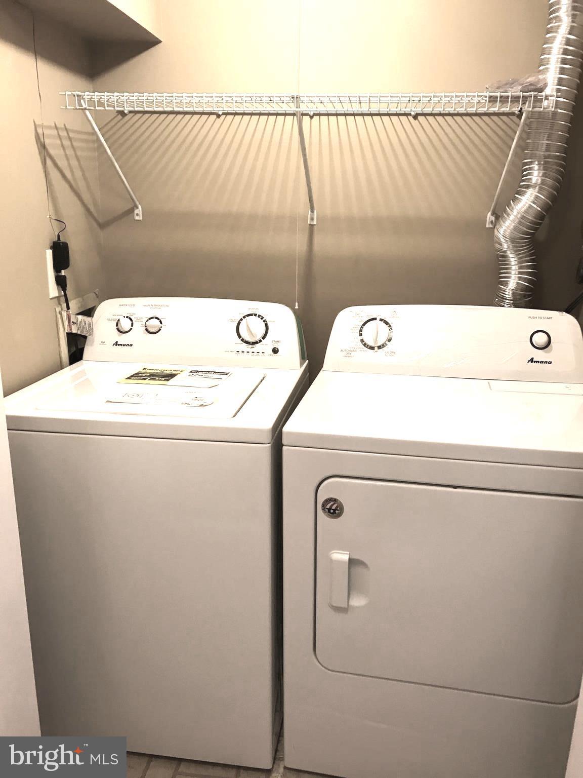 10504 Grove Ridge Place, Unit 48 Rockville, MD 20852 - Photo 27 of 30 a utility room with dryer and washer