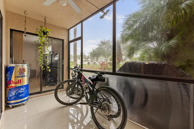 a view of water heater room with furniture and floor to ceiling window