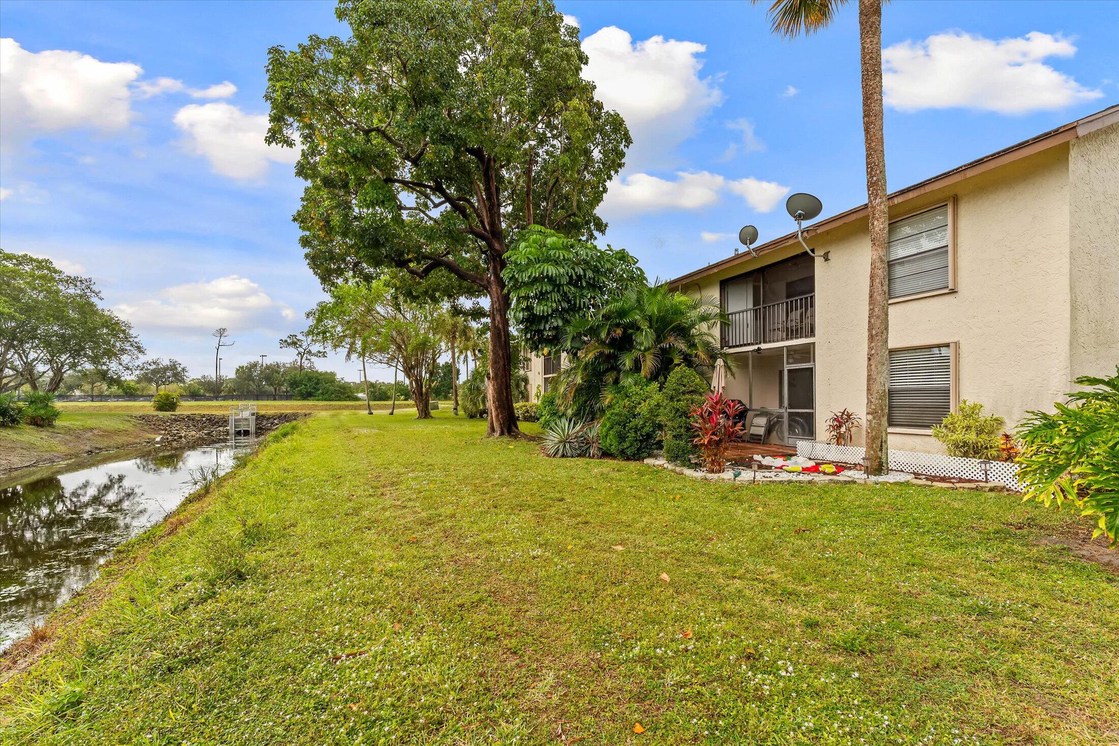 23466 Lyons Road, Unit 501 Boca Raton, FL 33428 - Photo 24 of 40 a view of a house with a swimming pool