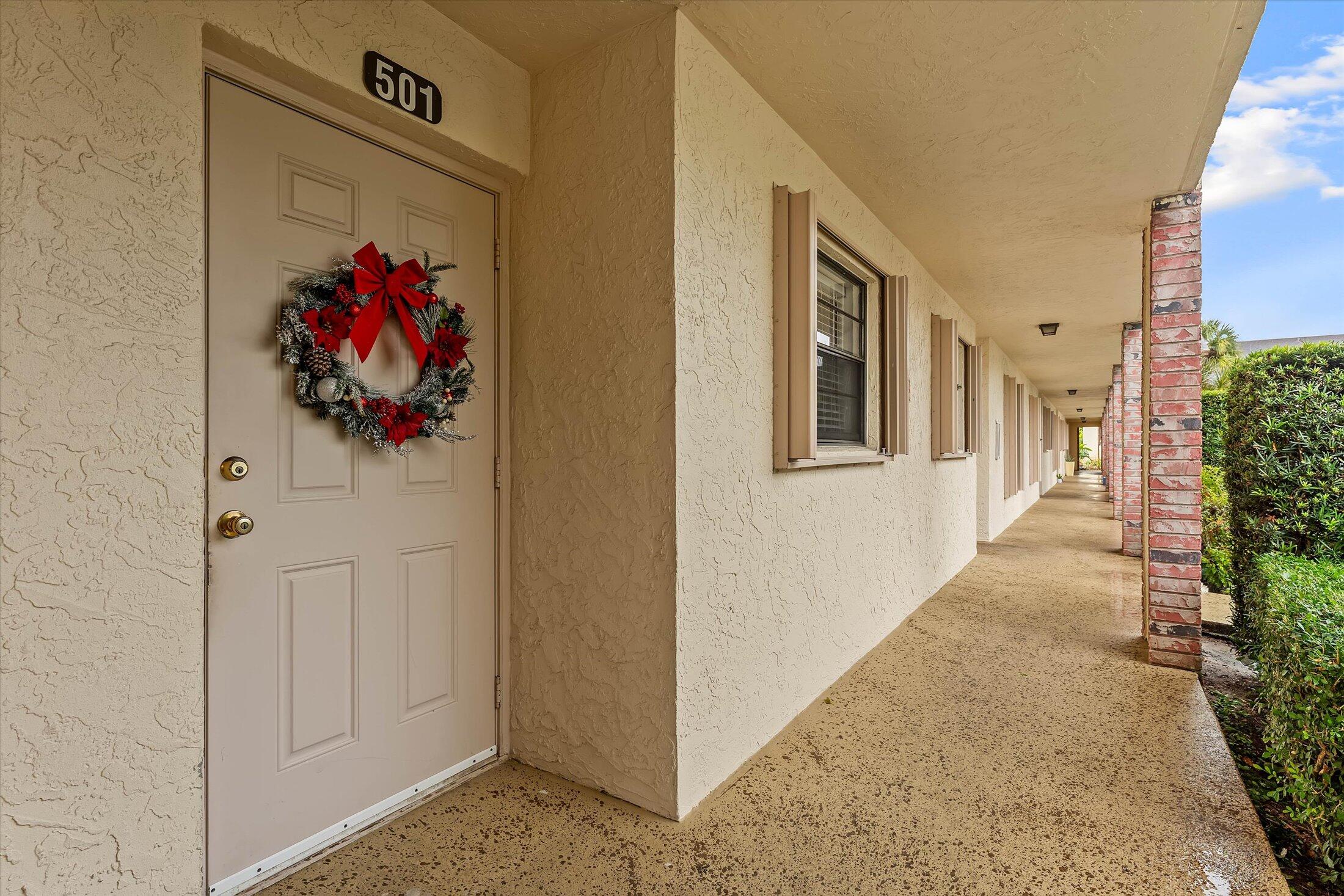 23466 Lyons Road, Unit 501 Boca Raton, FL 33428 - Photo 3 of 40 a view of a entryway door of the house
