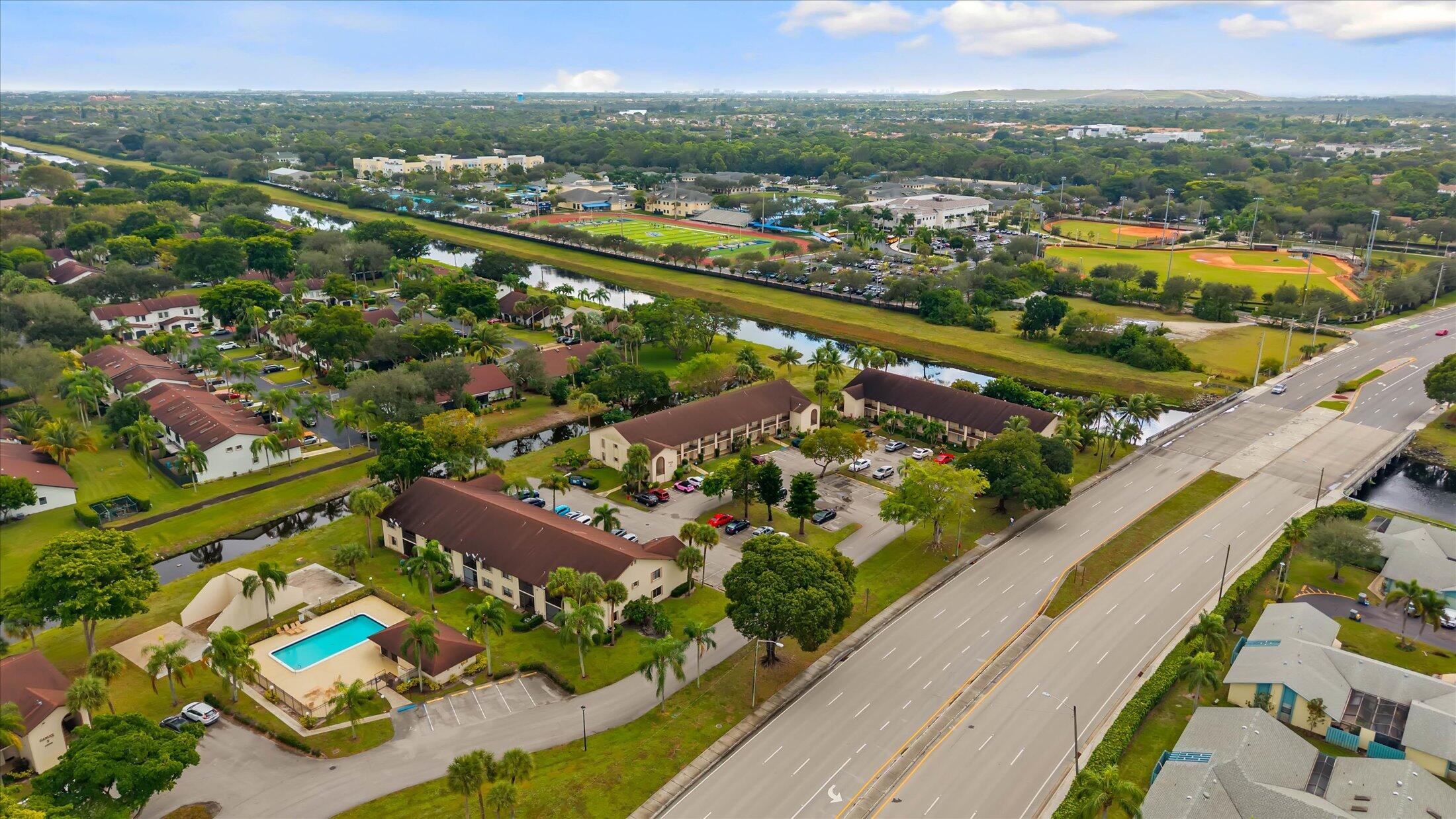 23466 Lyons Road, Unit 501 Boca Raton, FL 33428 - Photo 33 of 40 an aerial view of residential houses with outdoor space