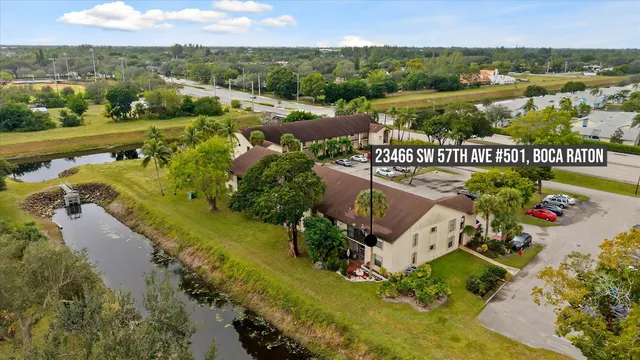 an aerial view of a city with mountains ocean view