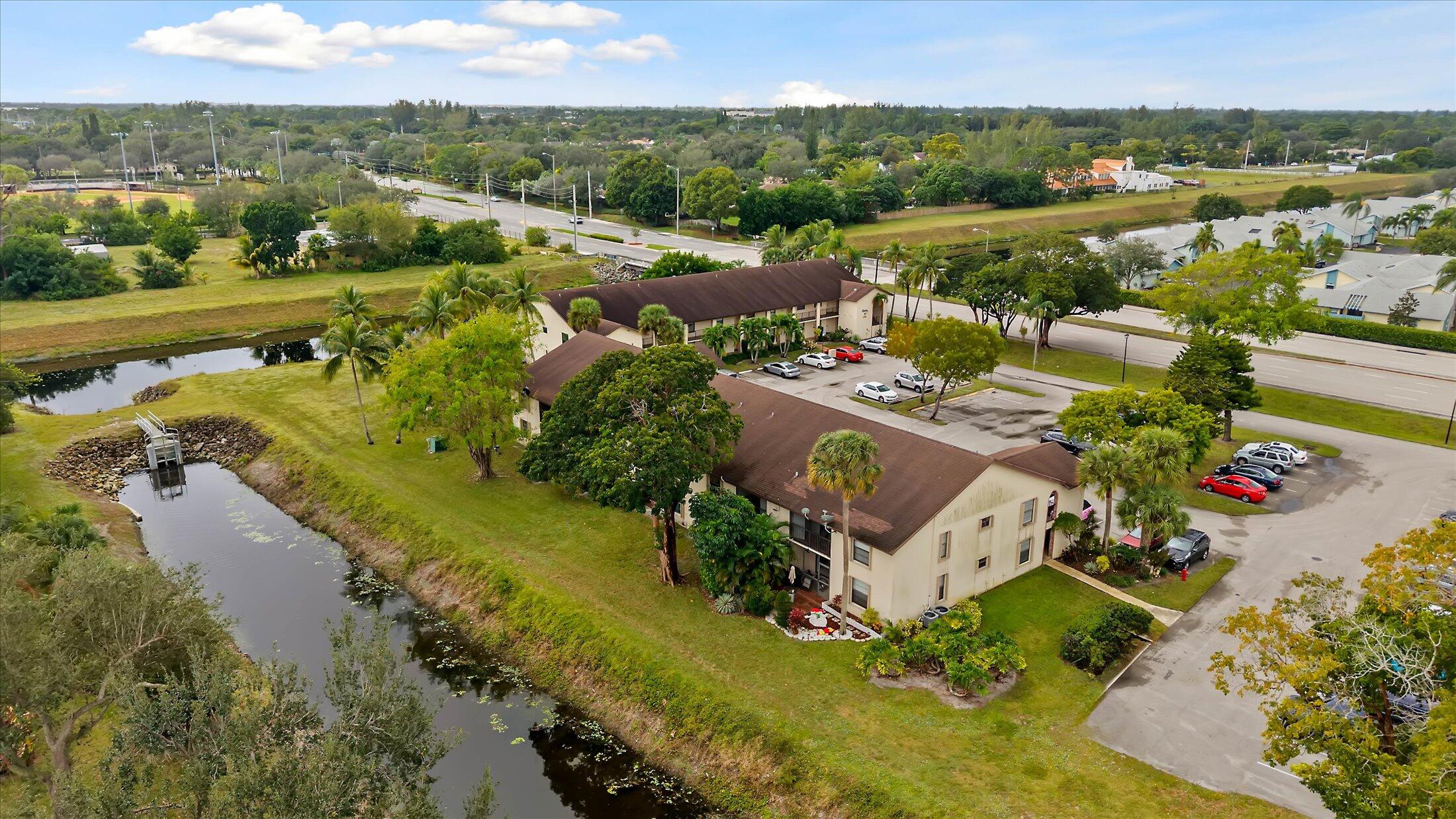 23466 Lyons Road, Unit 501 Boca Raton, FL 33428 - Photo 35 of 40 an aerial view of residential houses with outdoor space and river