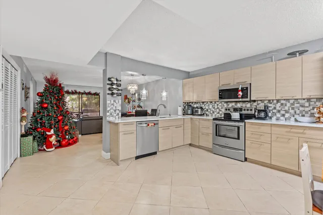 a kitchen with cabinets and window