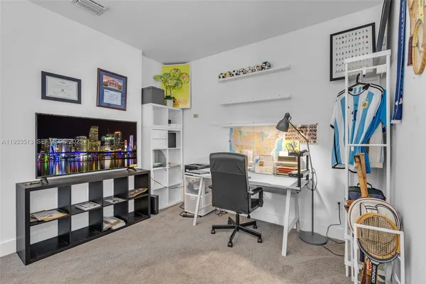 a view of a workspace with furniture