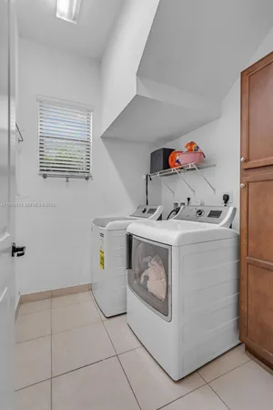 a utility room with washer and dryer