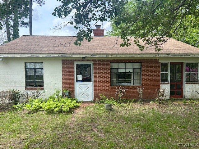 52 Short Road Heathsville, VA 22473 - Photo 1 of 1 Ranch-style home featuring a chimney and roof with