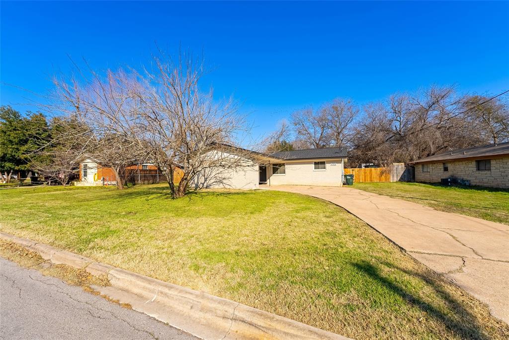 4306 Shallowbrook Trail Austin, TX 78744 - Photo 2 of 16 a swimming pool with trees in the background