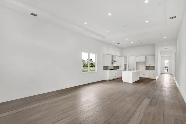 a view of kitchen with furniture and wooden floor