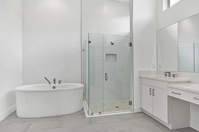 a bathroom with a bathtub and a sink