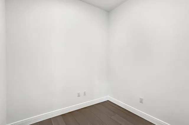 a view of a small space with wooden floor