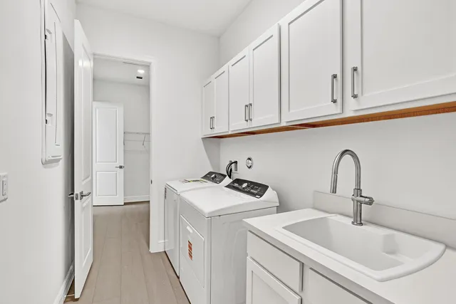 a view of a kitchen sink and cabinets