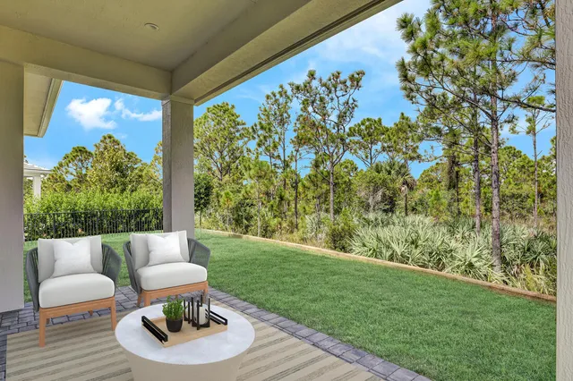 a outdoor living room with furniture and a garden