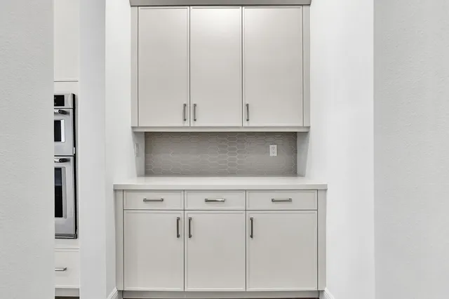 a view of cabinets and wooden floor