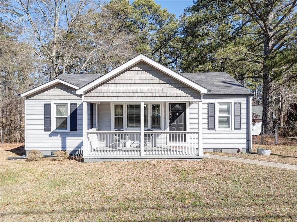 128 Stockmar Road Villa Rica, GA 30180 - Photo 1 of 1 a front view of a house with a yard
