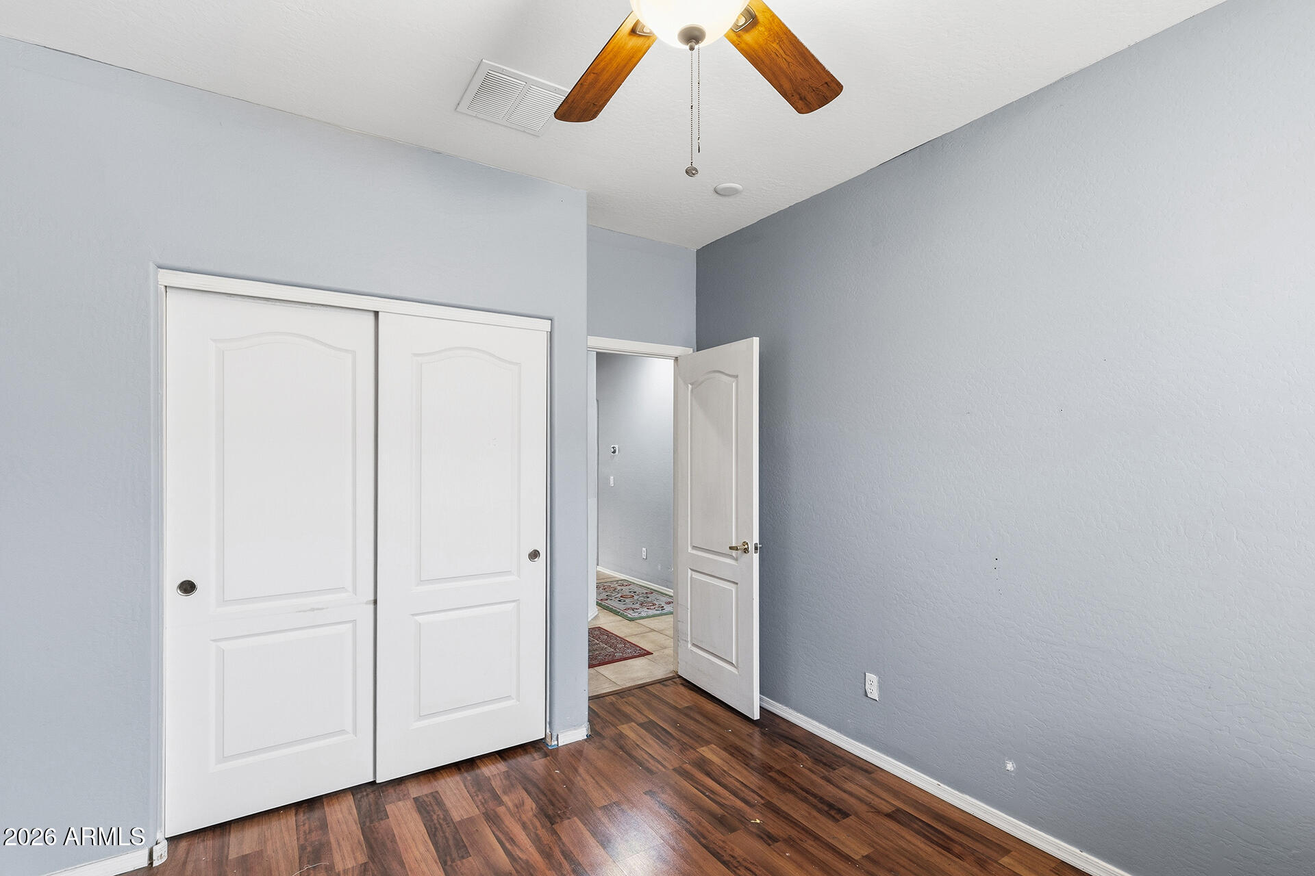6718 West Darrel Road Laveen, AZ 85339 - Photo 15 of 49 a view of empty room with wooden floor