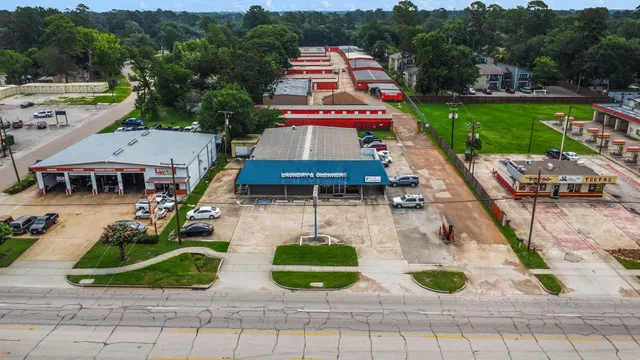 an aerial view of a house with swimming pool garden and patio