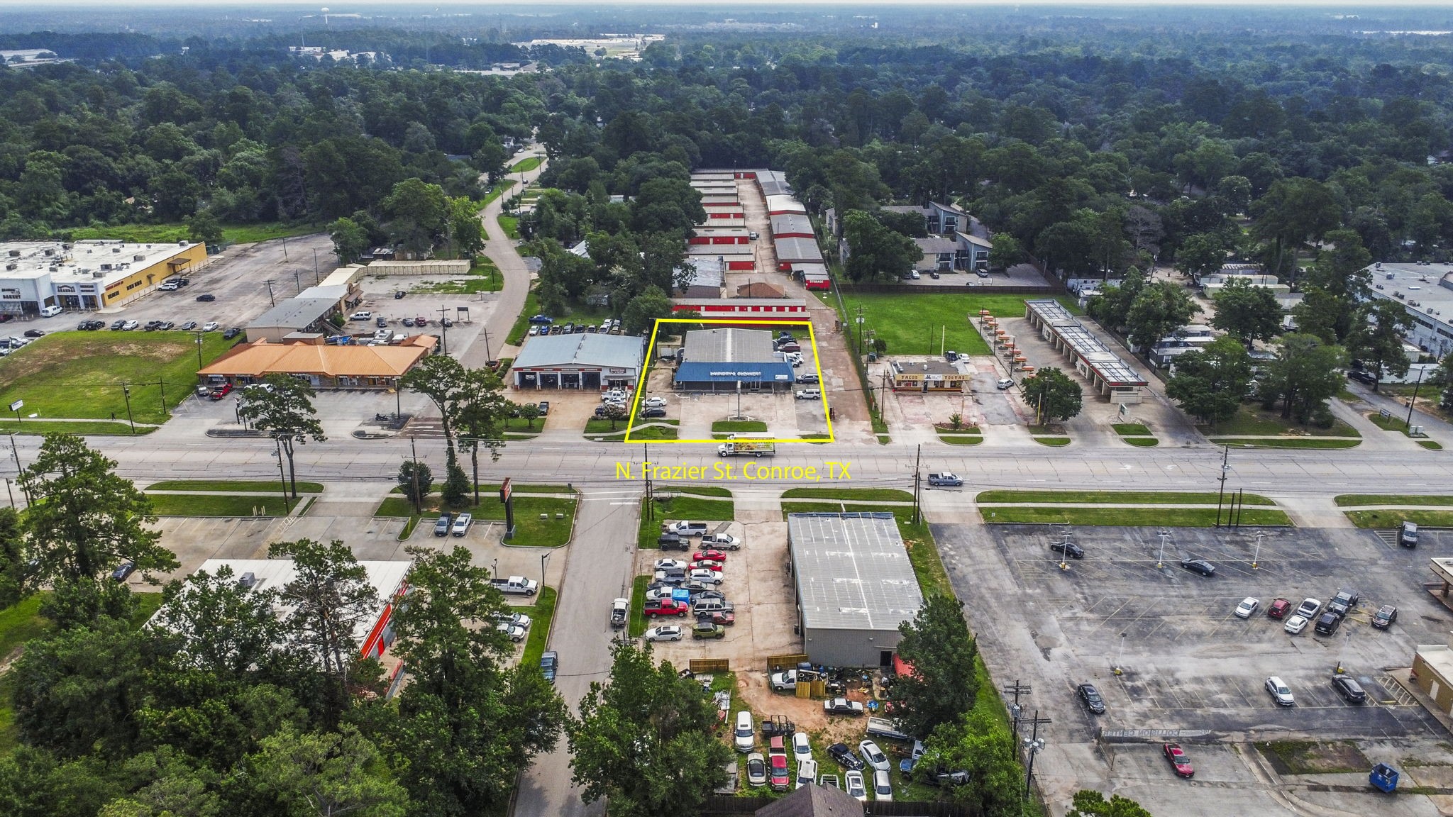 1806 North Frazier Street Conroe, TX 77301 - Photo 3 of 11 a aerial view of a house with a garden