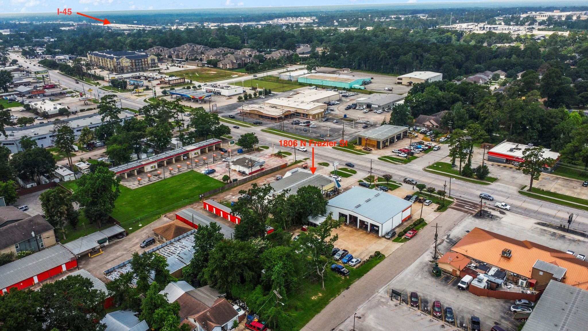 1806 North Frazier Street Conroe, TX 77301 - Photo 5 of 11 an aerial view of residential houses with outdoor space