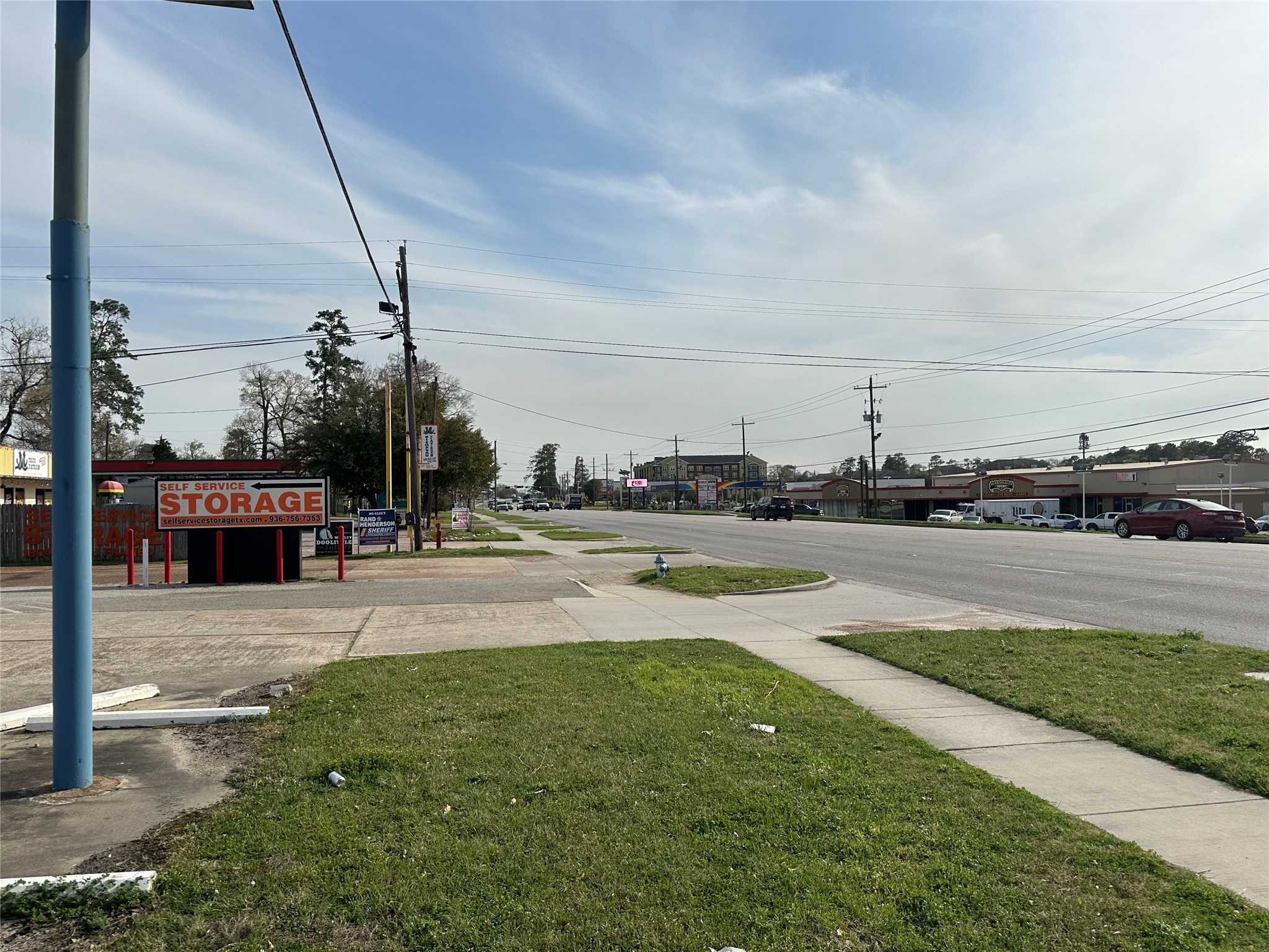 1806 North Frazier Street Conroe, TX 77301 - Photo 8 of 11 a view of a swimming pool with a yard