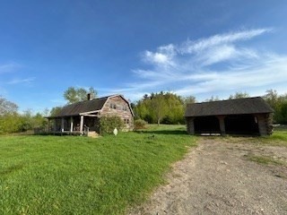 37 Smith Road Warwick, MA 01378 - Photo 16 of 21 a front view of a house with a yard and garage