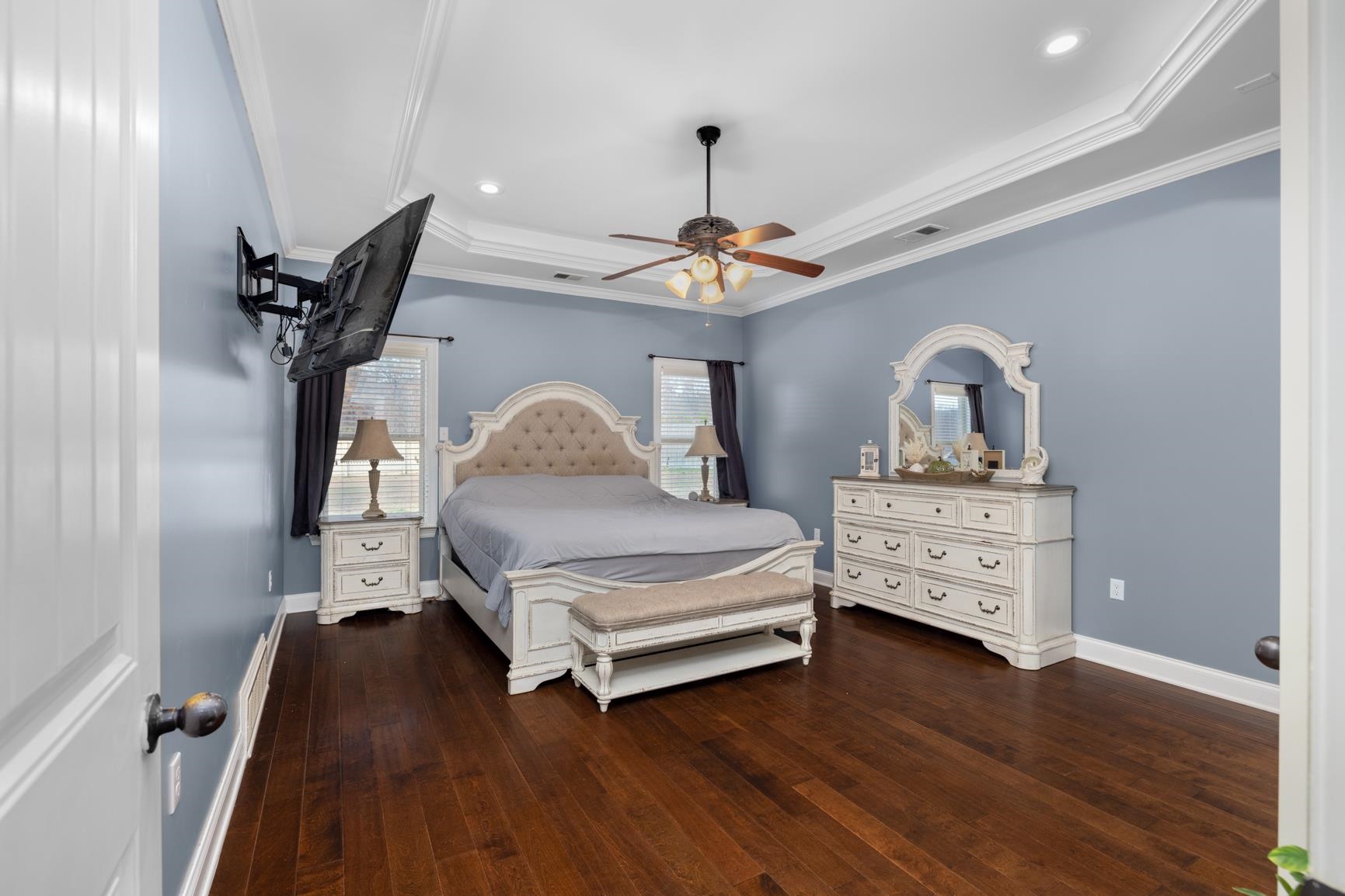 54 Palmer Cove Atoka, TN 38004 - Photo 13 of 40 Bedroom featuring dark wood finished floors, a tray ceiling, ceiling fan, ornamental molding, and recessed lighting