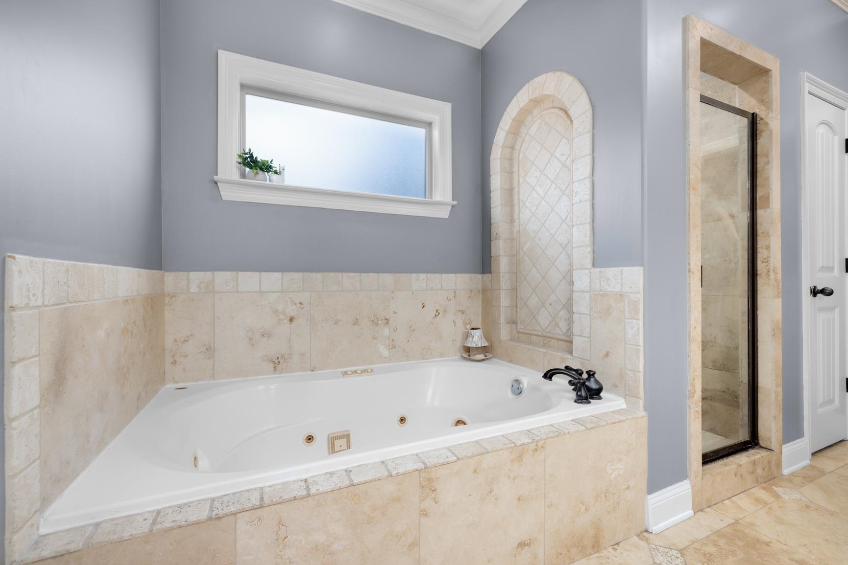 54 Palmer Cove Atoka, TN 38004 - Photo 17 of 40 Full bathroom featuring a whirlpool tub, a shower stall, and crown molding