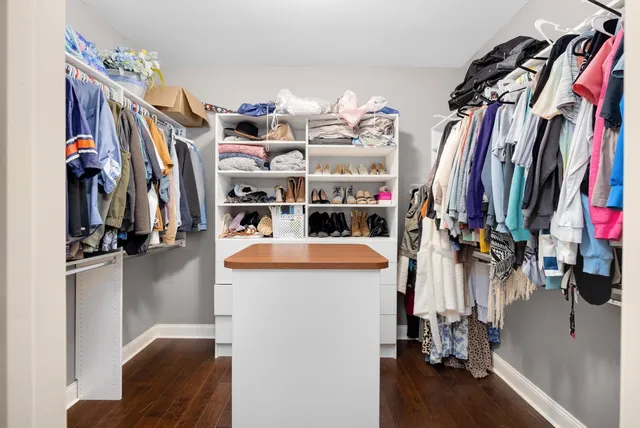 a white bath tub sitting next to a bathroom sink