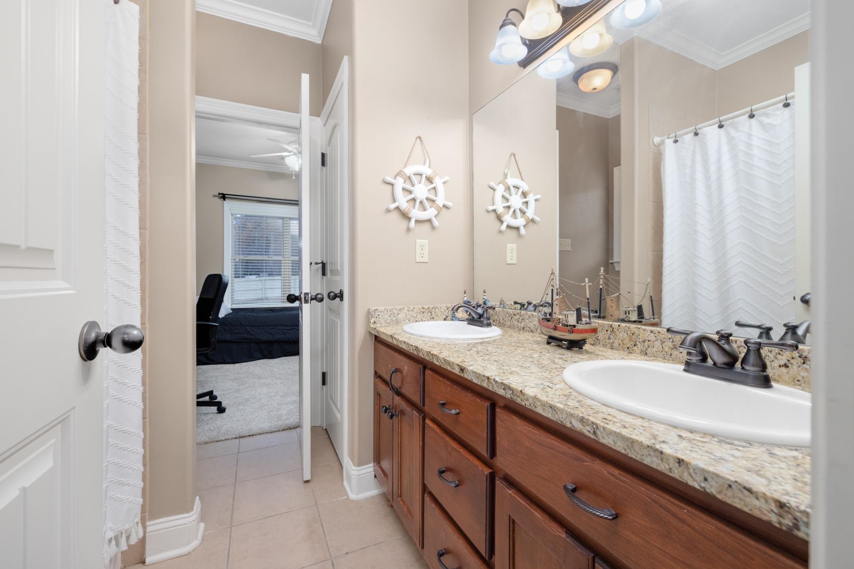 54 Palmer Cove Atoka, TN 38004 - Photo 22 of 40 Bathroom with ornamental molding, a shower with curtain, double vanity, light tile patterned flooring, and ensuite bathroom