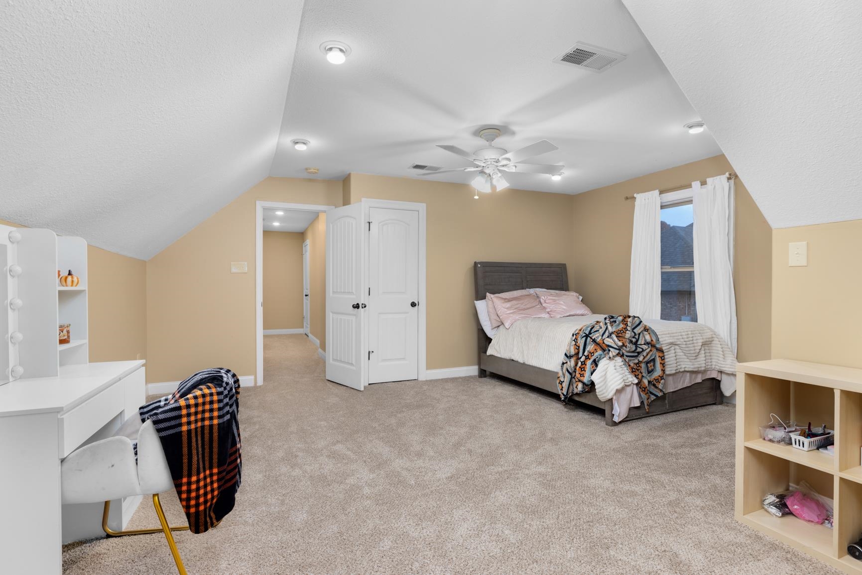 54 Palmer Cove Atoka, TN 38004 - Photo 29 of 40 Bedroom featuring light colored carpet, lofted ceiling, ceiling fan, and a textured ceiling