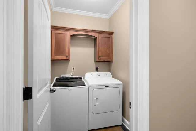 a view of storage and utility room with washer and dryer