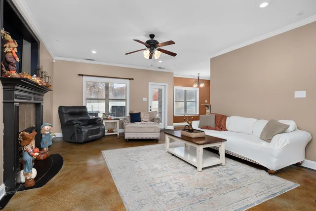 a living room with furniture and a fireplace