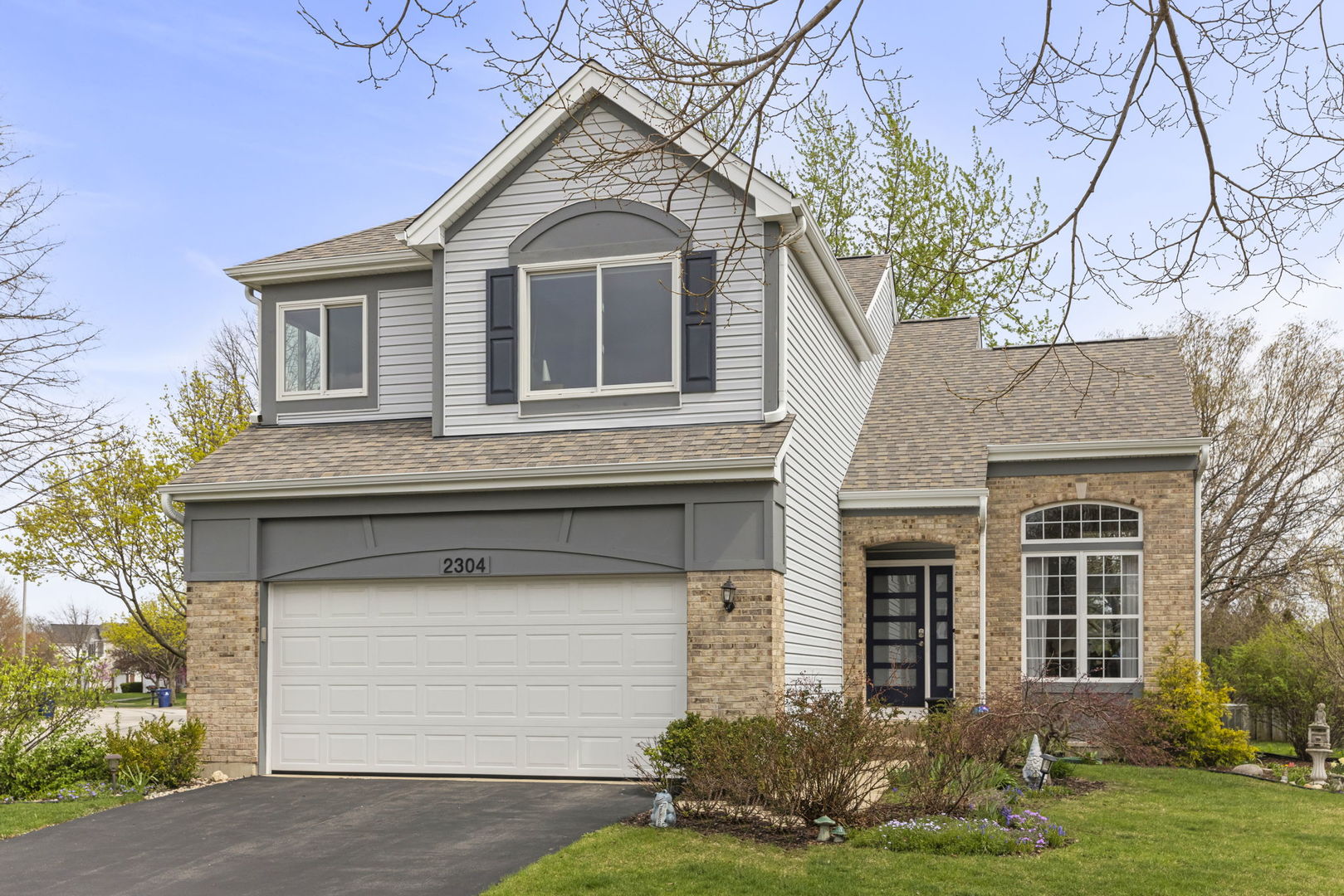 2304 Periwinkle Court Naperville, IL 60540 - Photo 1 of 1 a front view of a house with garden