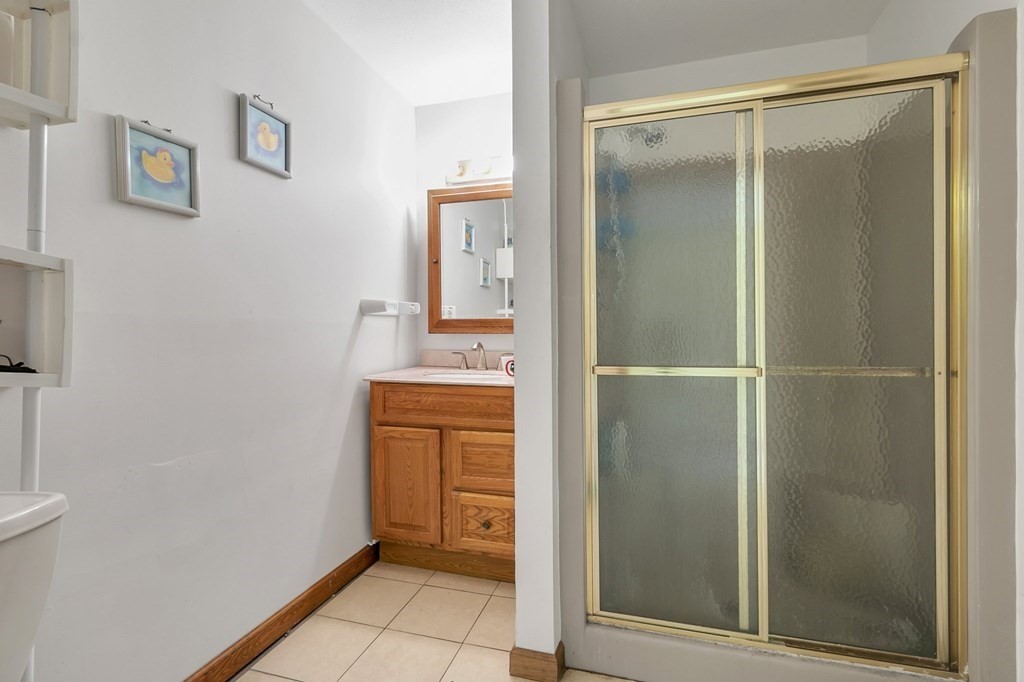 159 Hadley Street Springfield, MA 01118 - Photo 41 of 42 a bathroom with a shower and a sink
