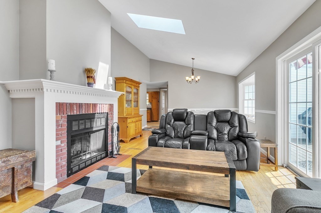 159 Hadley Street Springfield, MA 01118 - Photo 8 of 42 a living room with furniture and a fireplace