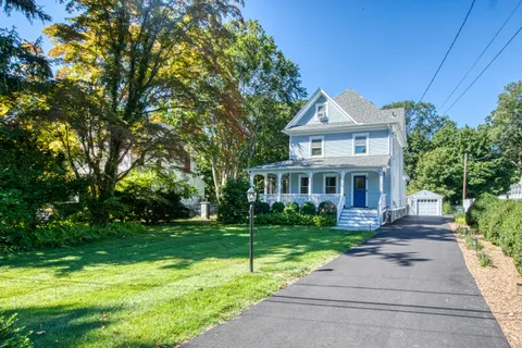 a front view of a house with yard