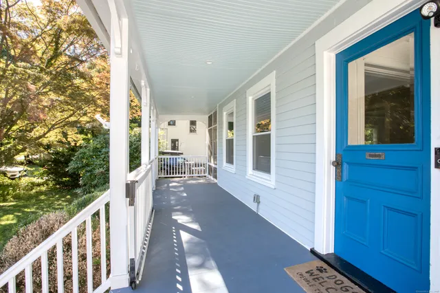 a view of a balcony with chairs