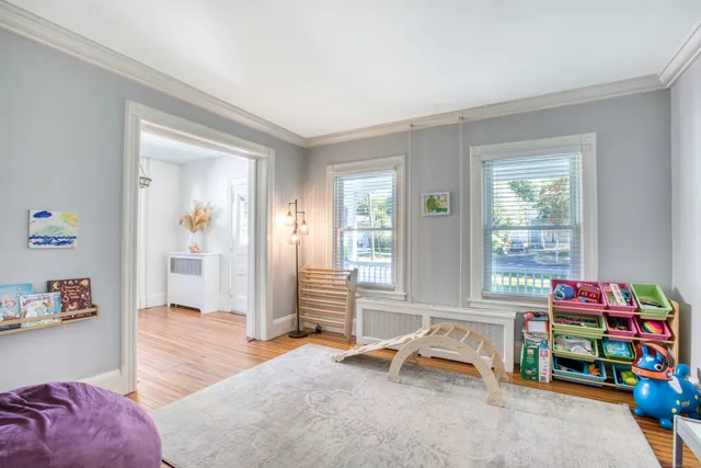 a bedroom with furniture and a window