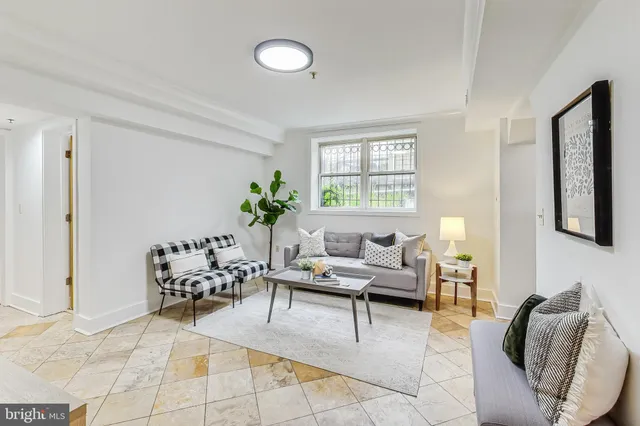 a living room with furniture and a large window