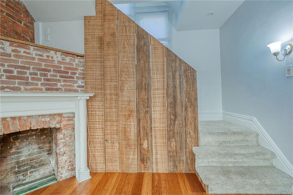 629 George Street Coraopolis, PA 15108 - Photo 11 of 25 Decorative fireplace with rustic brick and barn wood accent wall.