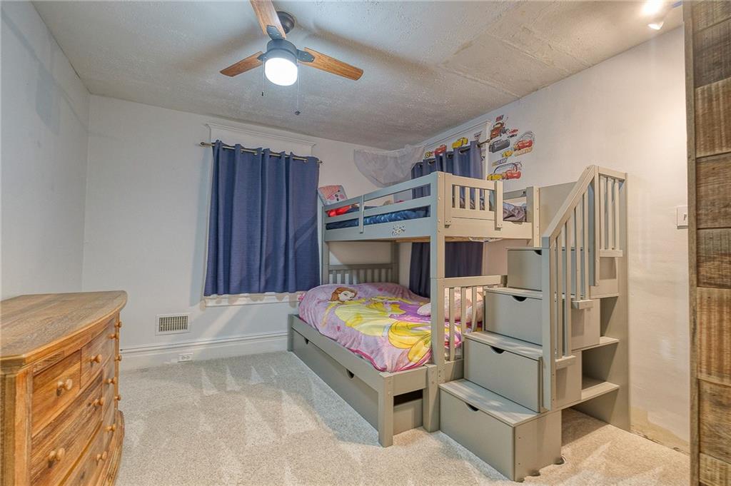 629 George Street Coraopolis, PA 15108 - Photo 14 of 25 Second bedroom newer ceiling fan, and carpeting.