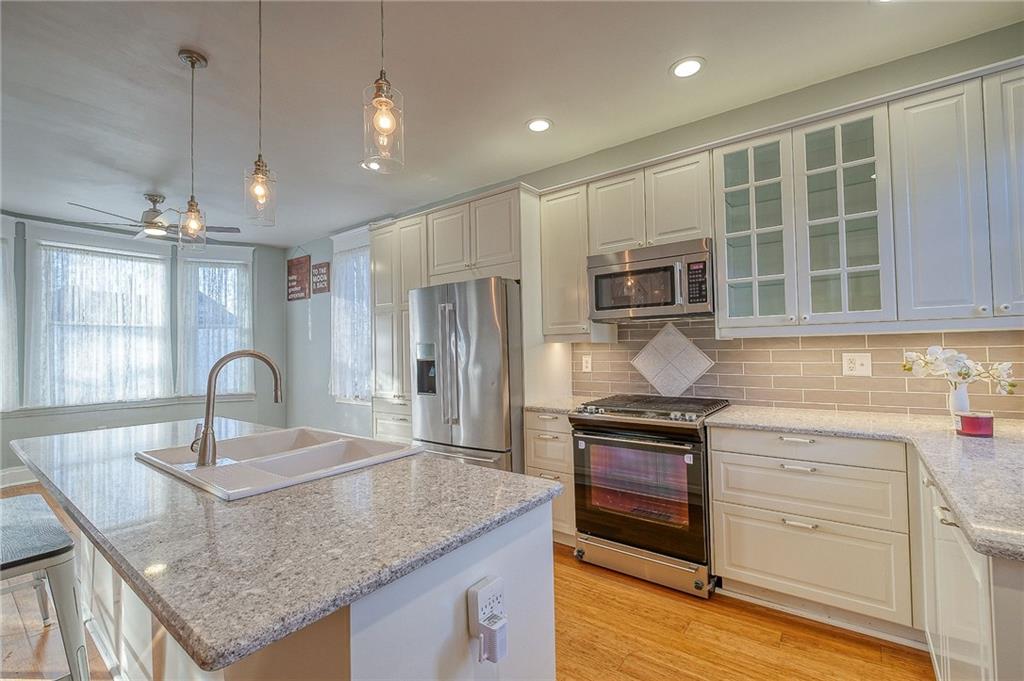 629 George Street Coraopolis, PA 15108 - Photo 3 of 25 Totally renovated Kitchen. Open floor plan, updated lighting, bamboo flooring, huge island great for entertaining.