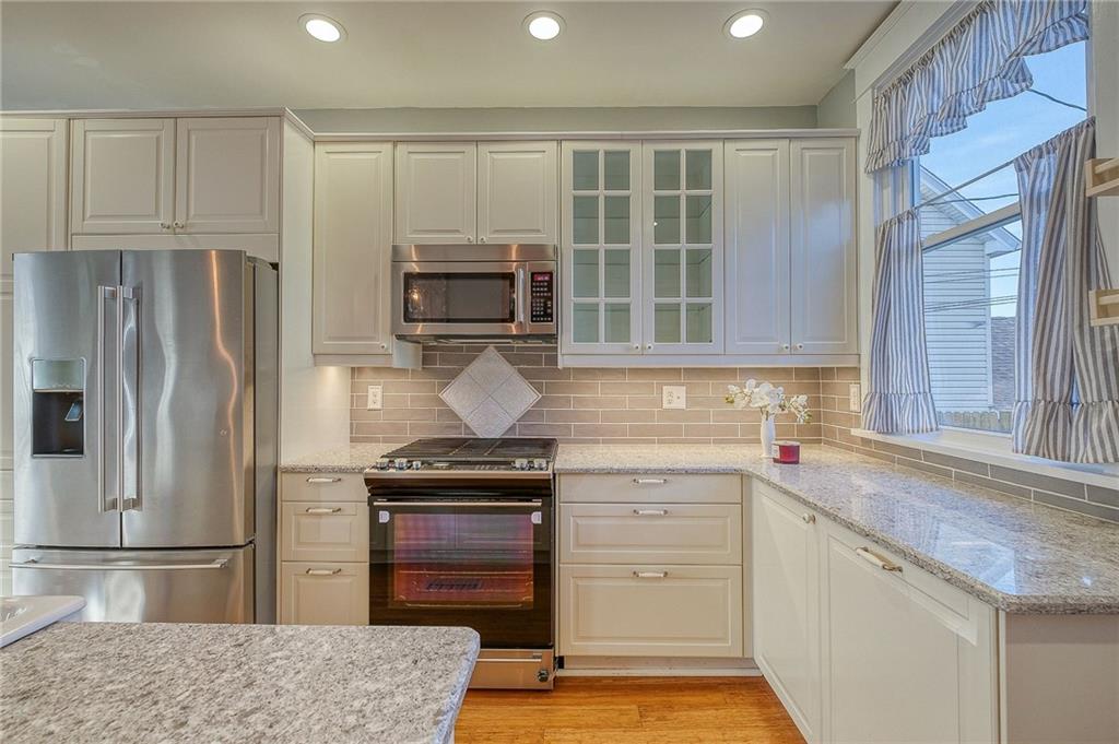 629 George Street Coraopolis, PA 15108 - Photo 6 of 25 Custom back splash, recessed lighting and additional counter space makes completes this spacious kitchen.