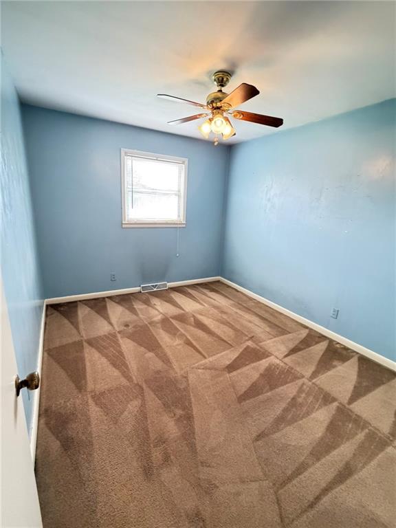 52 Lyons Drive Northwest Rome, GA 30165 - Photo 12 of 34 a bedroom with a bed and a chandelier