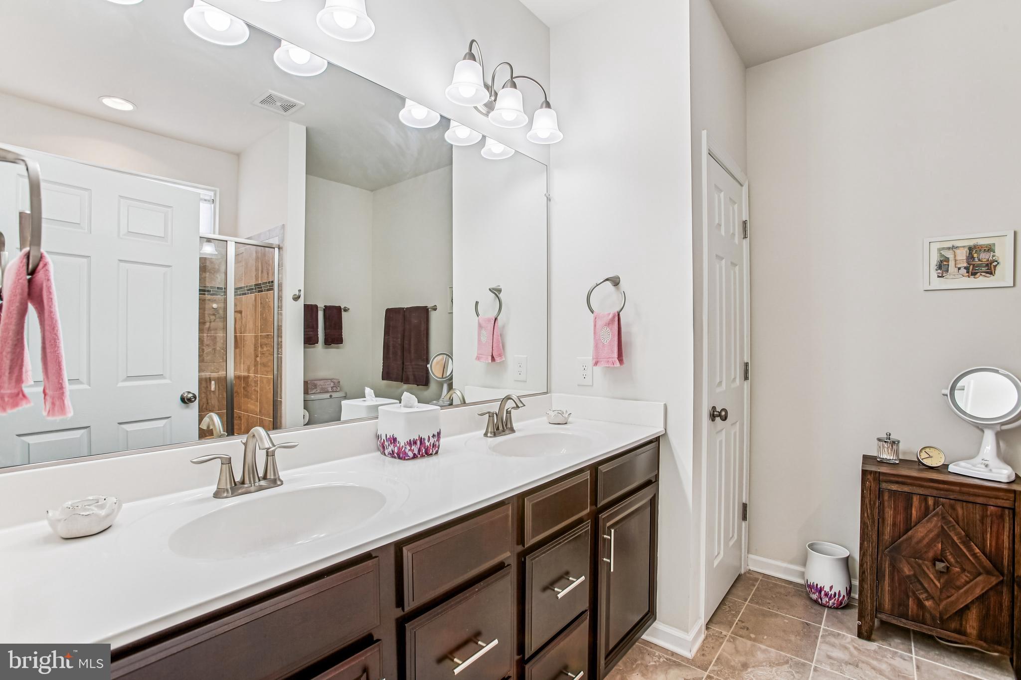 187 Denison Street Fredericksburg, VA 22406 - Photo 23 of 40 a bathroom with a sink double vanity and a mirror