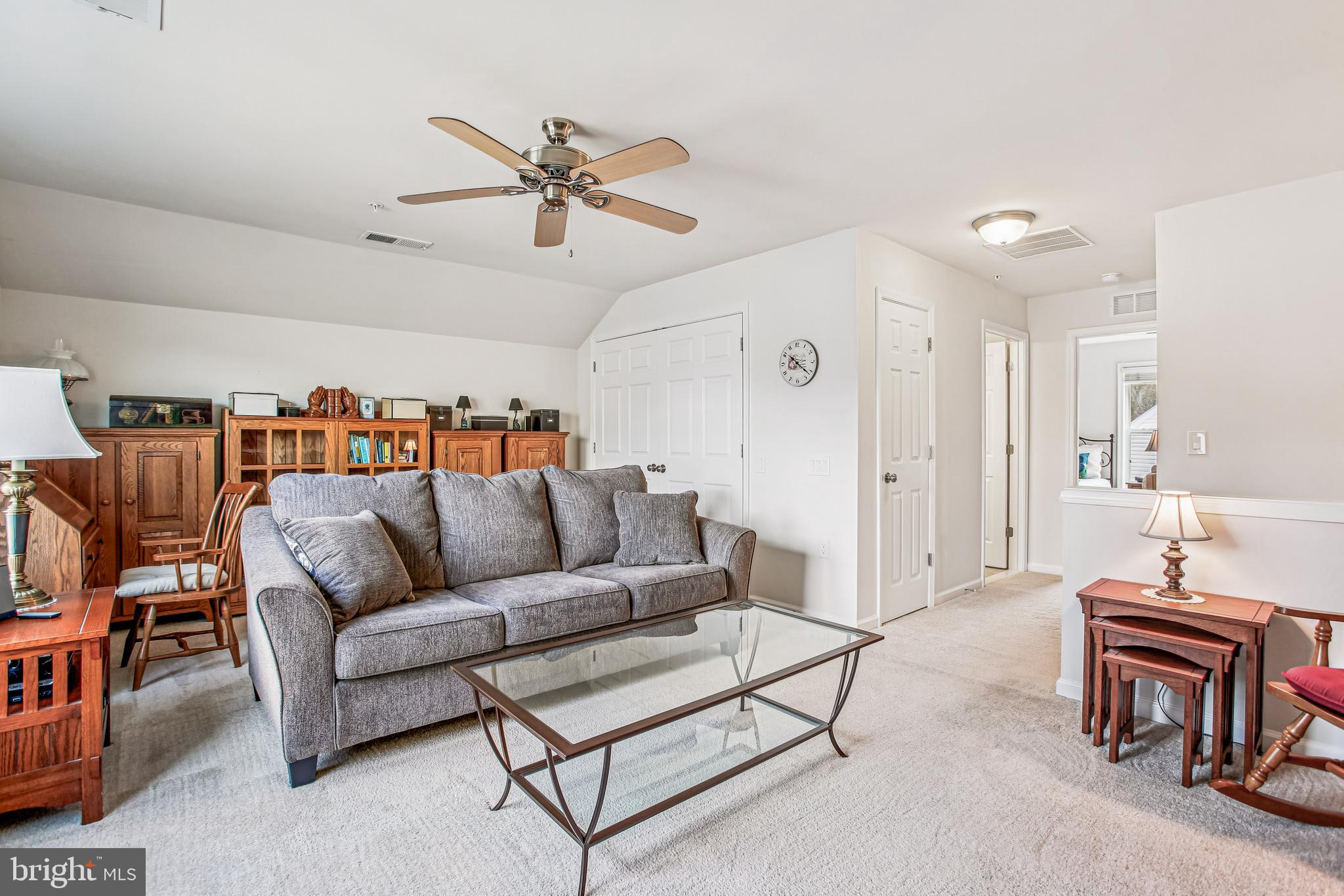 187 Denison Street Fredericksburg, VA 22406 - Photo 32 of 40 a living room with furniture and a chandelier