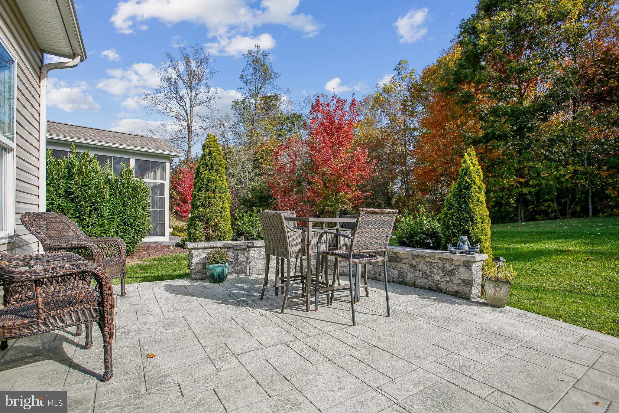 187 Denison Street Fredericksburg, VA 22406 - Photo 39 of 40 a view of a patio with a table and chairs and potted plants